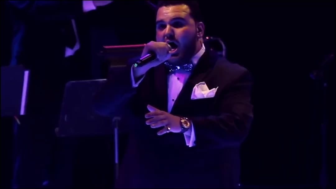 Sal Valentinetti singing Love Is a Many Splendored Thing on stage with Black Tie Brass